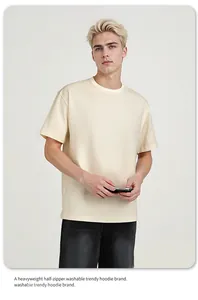 Detailed view of a heavyweight 260g cream cotton short-sleeved t-shirt on a model