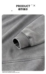 Gros plan du poignet d'un sweat à capuche gris délavé lourd avec bord-côte