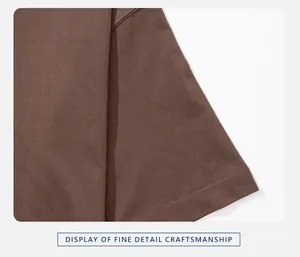 Close-up detail of premium stitching and fabric texture on a brown cotton t-shirt hem
