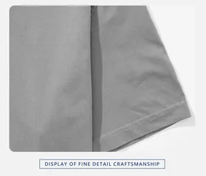 Close-up detail of premium double-stitched hem on a grey cotton short sleeve T-shirt