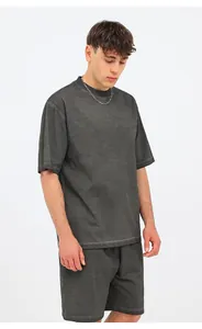 Model wearing vintage wash grey oversized crewneck cotton t-shirt and matching shorts