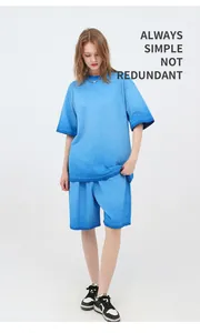 Full body shot of a model wearing a blue gradient cotton crewneck t-shirt and shorts