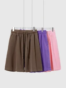 Collection de trois shorts en coton délavé vintage avec cordon en marron, violet et rose