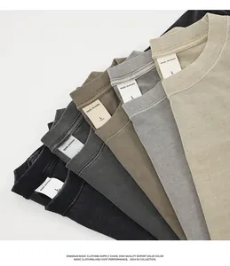 Detail of heavy 280g salt-washed cotton t-shirts showing necklines and colors