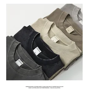Close-up of salt-washed distressed pure cotton t-shirts in various neutral earthy colors