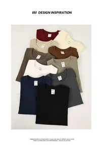 Detail of heavyweight 320g cotton crew neck t-shirts in multiple solid colors.