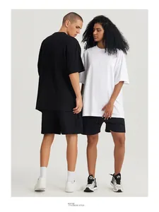 Detailed view of oversized 270g heavyweight cotton drop shoulder t-shirts on models
