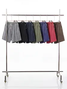 Premium men's vintage washed distressed cotton shorts in various colors on a rack
