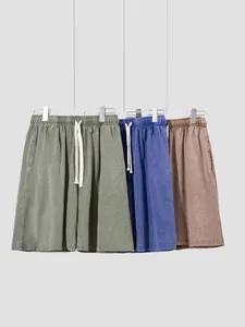 Men's vintage washed cotton shorts in green, blue, and brown with drawstring waist