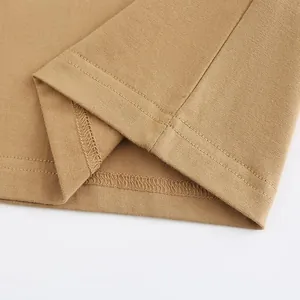 Close-up macro view of high-quality heavy cotton T-shirt hem with double-needle stitching detail