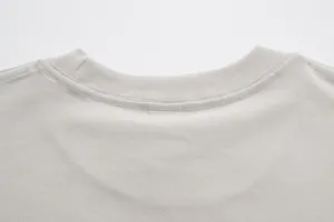 Macro view of high-quality reinforced stitching on a crew neck pure cotton t-shirt neckline