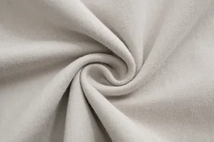 Macro detail of high-quality breathable gray cotton fabric for comfortable t-shirts