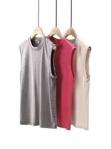 Detailed macro view of vintage washed cotton sleeveless tank tops in multi-colors