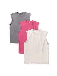 Set of three washed cotton oversized tank tops in gray, pink, and cream colors.