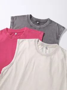 Detailed view of three washed distressed cotton sleeveless tank tops in multiple colors