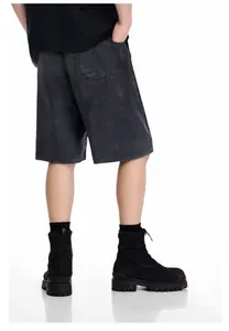 Detailed back view of men's washed distressed black denim shorts in streetwear style.