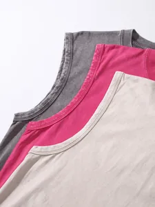 Macro view of necklines on three washed distressed cotton sleeveless vests