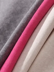 Close-up detail of 230G heavy washed cotton fabric in multiple colors for tank tops