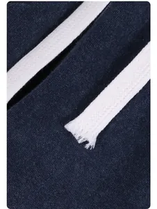 Close-up detail of white woven drawstring on navy blue vintage washed cotton shorts