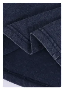 Macro detail of 250G vintage washed navy blue cotton fabric with high-quality stitching.