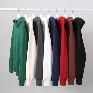 Detailed view of various colorful heavyweight oversized hoodies hanging on a rack