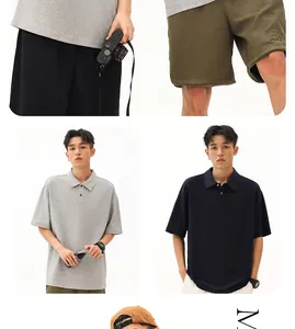 Male model wearing 260g heavyweight cotton polo shirt in grey and navy, street fashion style