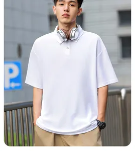 Professional street style shot of a heavyweight white cotton Polo shirt on a male model
