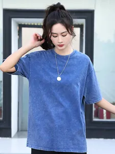 Model wearing oversized vintage snow wash blue heavy cotton T-shirt with a loose fit