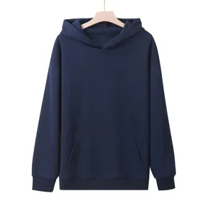 Macro view of the navy blue oversized hoodie showing the front kangaroo pocket and texture