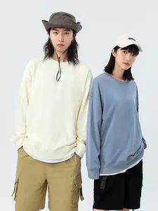 Oversized heavy loopback cotton crewneck sweatshirts for couples in cream and dusty blue