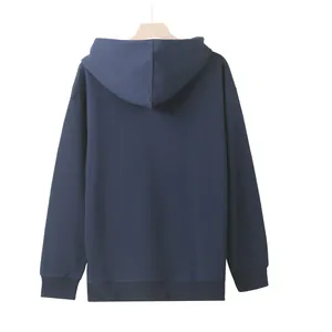 Detail view showing the back profile of a heavyweight navy blue hoodie on a wooden hanger.