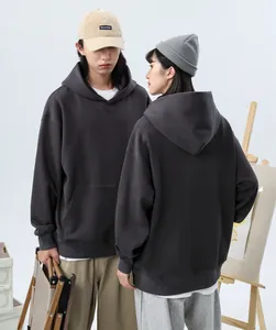 Front and back view of oversized charcoal gray heavyweight hoodies on male and female models