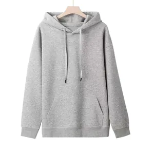 Front view of a grey oversized hoodie with kangaroo pocket and adjustable drawstrings