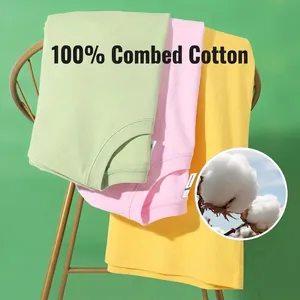 Stack of folded 180g combed cotton crew neck T-shirts in green, pink, and yellow