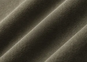 Close-up macro detail of premium 360G washed cotton fabric for vintage hoodies