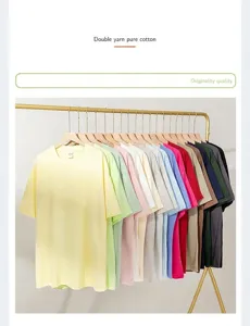 Multiple colorful men's combed cotton drop shoulder t-shirts hanging on a golden rack