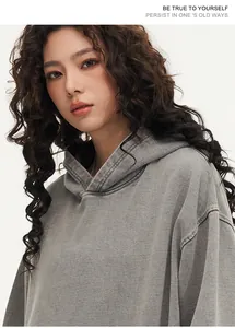 Close-up of vintage washed grey 450g heavyweight cotton oversized hooded sweatshirt