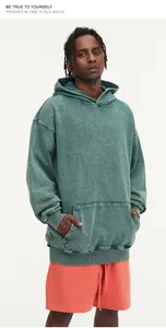 Close-up of vintage-washed 450G heavy cotton hoodie showing fabric texture and oversized fit