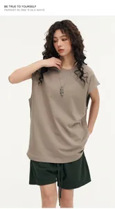 Close-up detail of oversized street style sleeveless vest in khaki on model