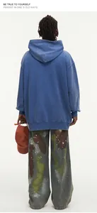 Back view of a blue washed vintage oversized hoodie made from 450G heavyweight cotton fabric