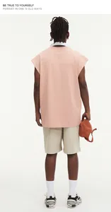 Back view of a street style oversized pink sleeveless t-shirt for men