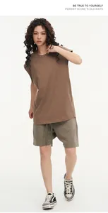 Loose brown sleeveless cotton t-shirt and olive green shorts set on a female model