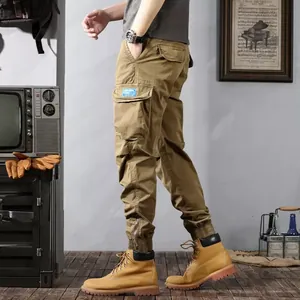 Detailed side view of retro khaki cargo jogger pants with functional multi-pockets.