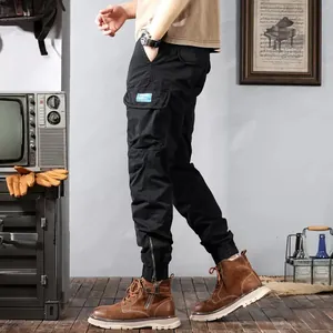 Detailed side view of black vintage cargo jogger pants with multi-pockets and ankle zippers