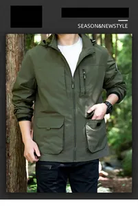 Detailed view of men's olive green outdoor windbreaker jacket with utility pockets