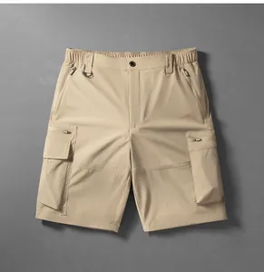 Front view of khaki quick-dry cargo shorts showing multi-pocket and waist details