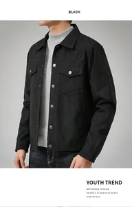 Detail of men's black suede jacket showing the texture and buttoned chest pockets.