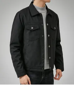 Detail view of men's premium black suede jacket with chest pockets and classic collar