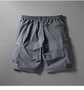 Detailed back view of men's quick-dry cargo shorts featuring elastic waist and multiple pockets