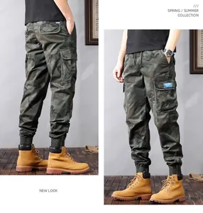 Detail view of camouflage cargo joggers featuring multi-pocket design